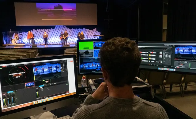 Technician running live video and audio for a corporate event
